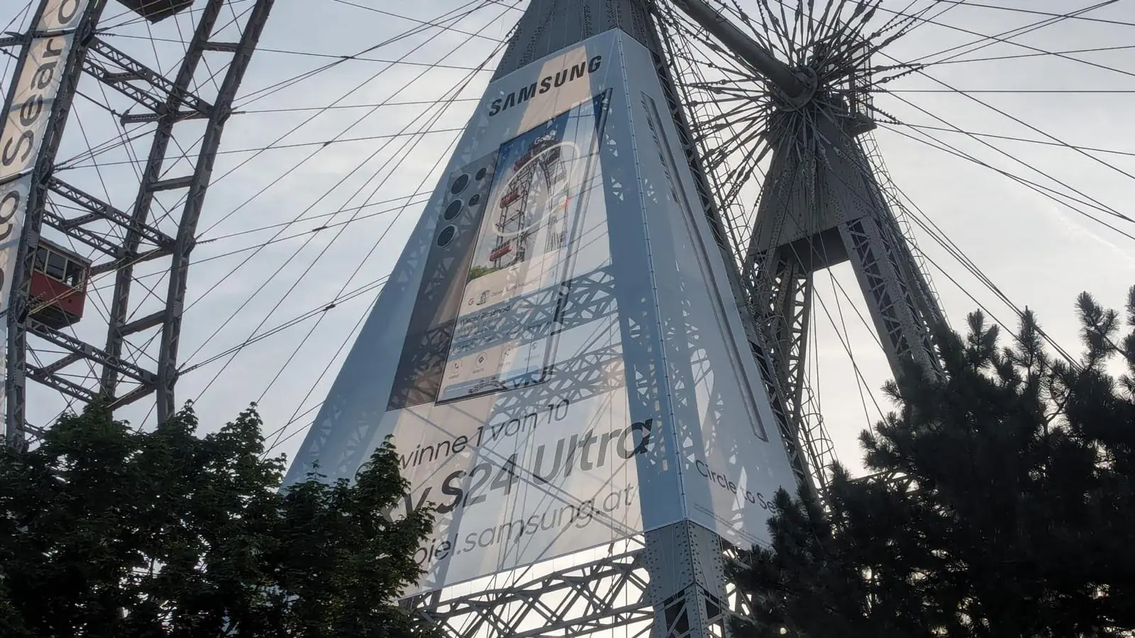 Looking up at the campaign banner through the spokes