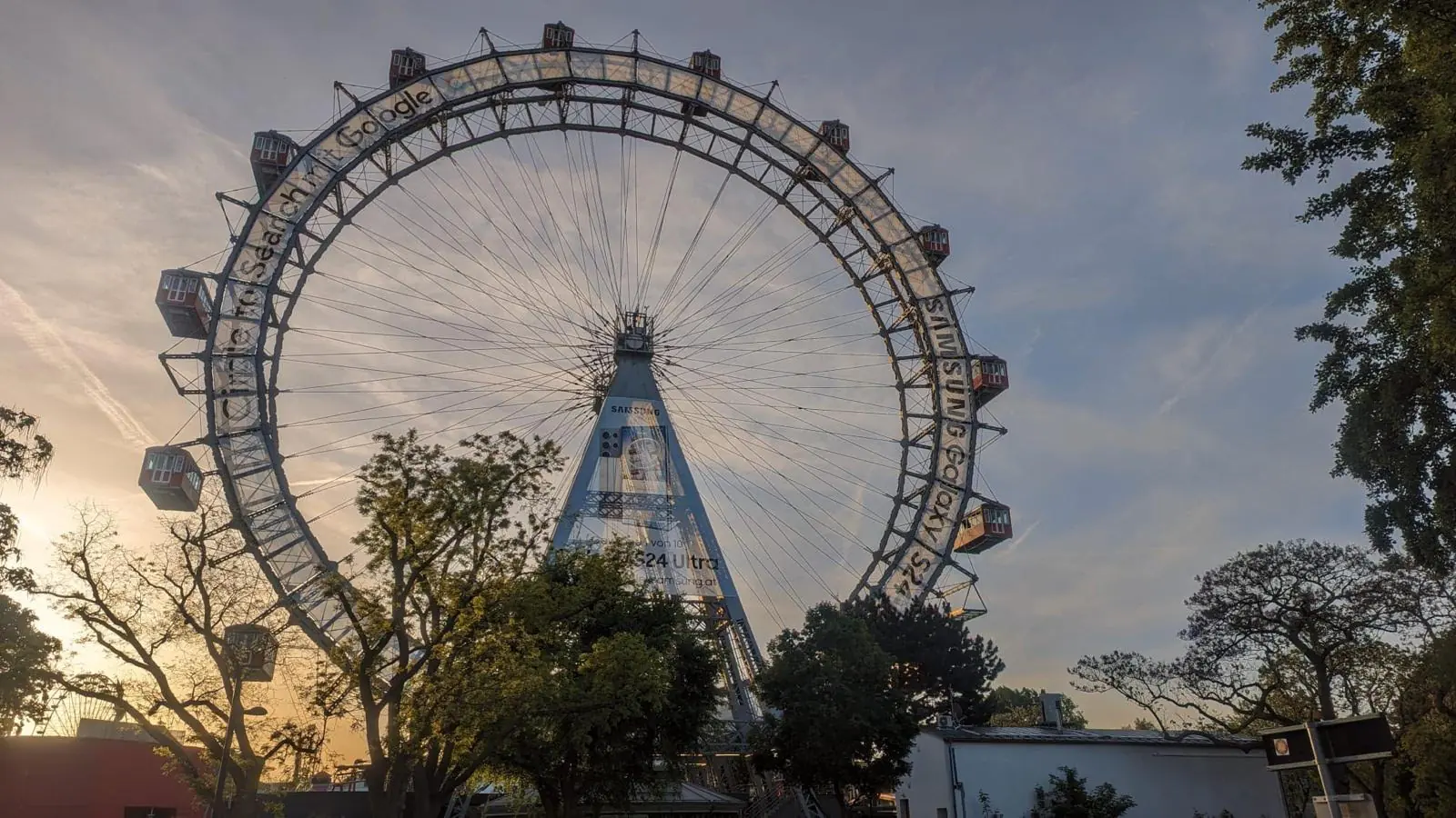 The Wiener Riesenrad at dusk, wrapped in the Galaxy S24 Ultra campaign